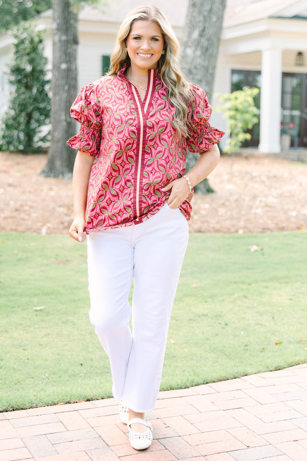 Plus Size wine-colored cotton top with a geometric pattern, V-neckline, and puffed short sleeves.