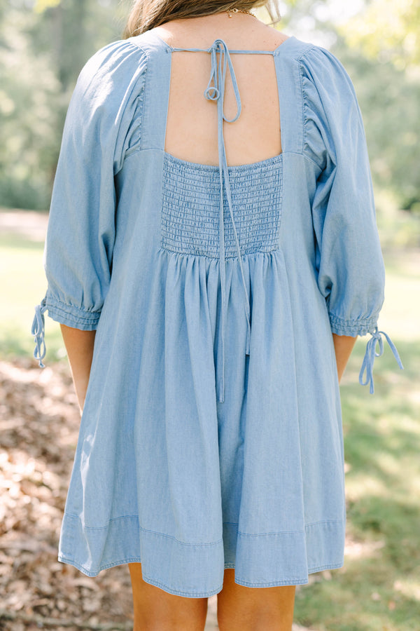 Plus Size light blue denim-look dress with a square neckline, pleated bodice, and puff sleeves.