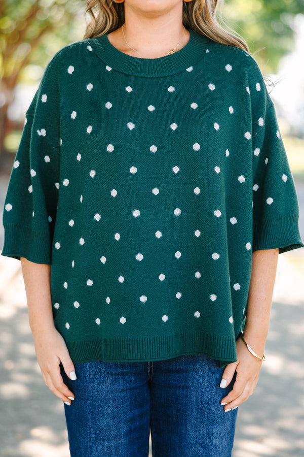 Plus Size hunter green knit sweater with white polka dots, crew neck, and wide three-quarter sleeves.