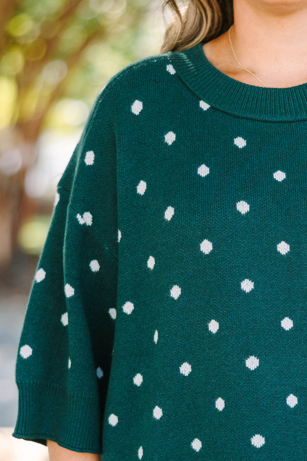 Plus Size hunter green knit sweater with white polka dots, crew neck, and wide three-quarter sleeves.
