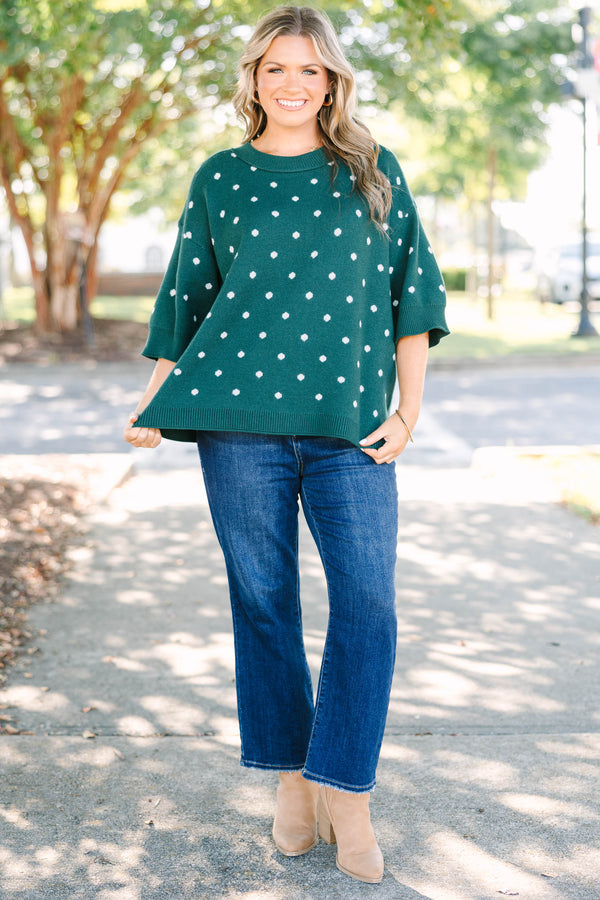 Plus Size hunter green knit sweater with white polka dots, crew neck, and wide three-quarter sleeves.