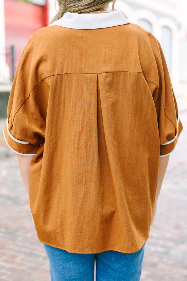 Plus Size brown tunic blouse with a white V-neck collar, relaxed fit, and white trim on the sleeves.