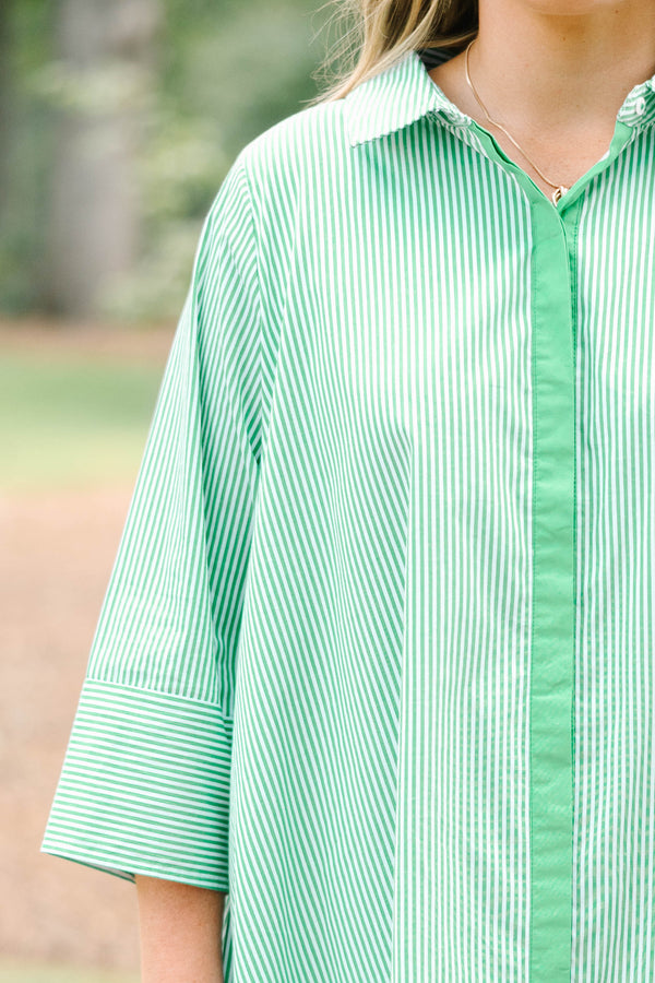 Plus size green and white striped cotton shirt dress with three-quarter sleeves and a flowy fit.