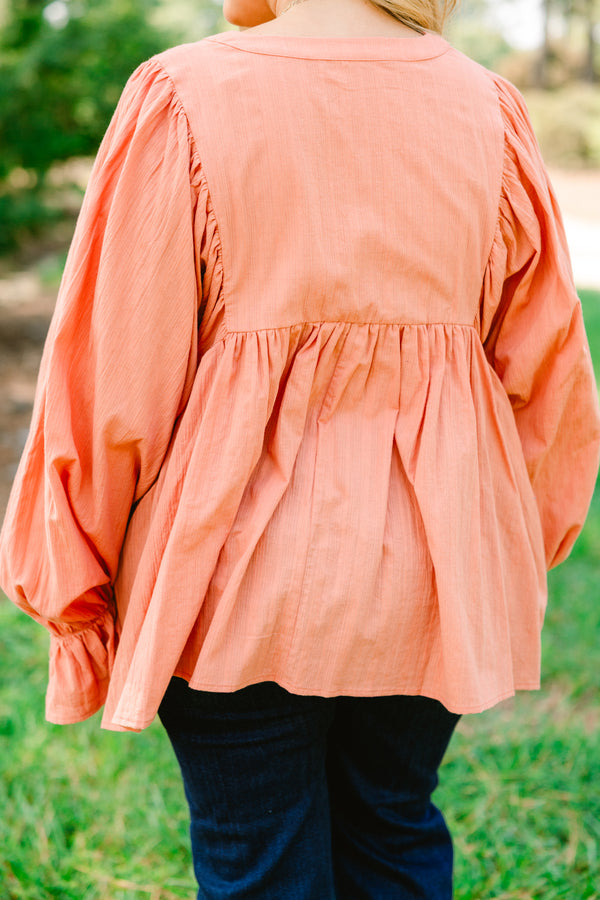 Chic Soul plus size clothing, salmon pink long sleeve button up top with ruffles on the end of the sleeves
