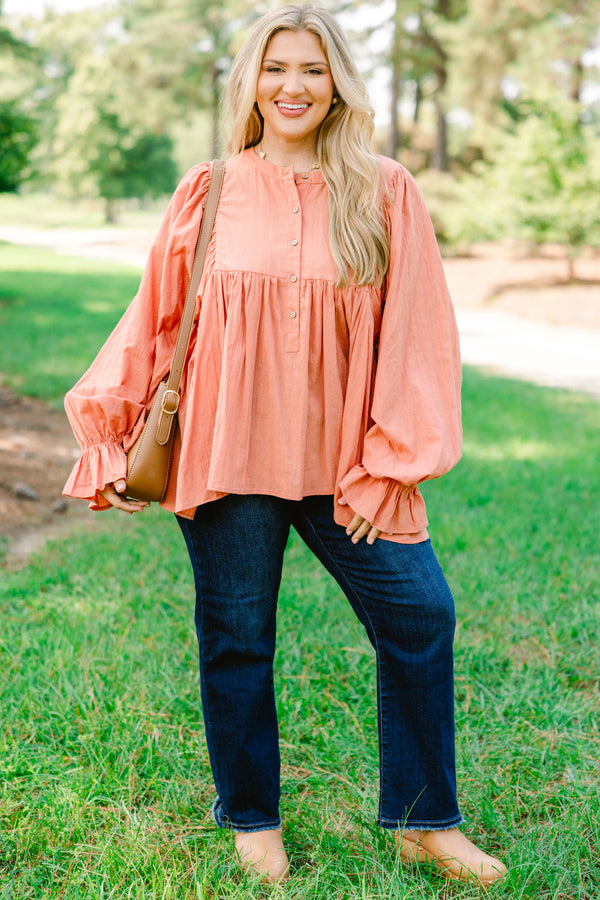 Chic Soul plus size clothing, salmon pink long sleeve button up top with ruffles on the end of the sleeves
