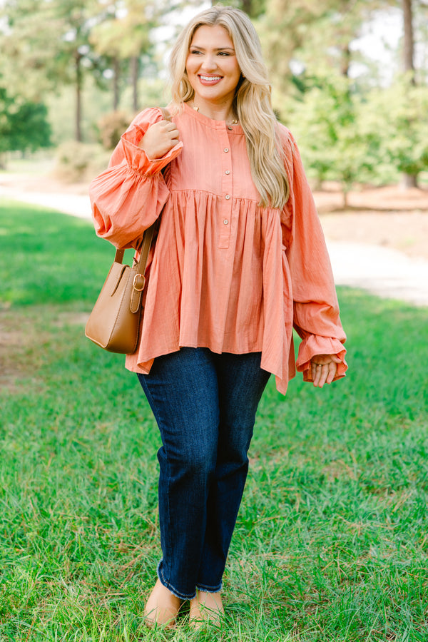 Chic Soul plus size clothing, salmon pink long sleeve button up top with ruffles on the end of the sleeves

