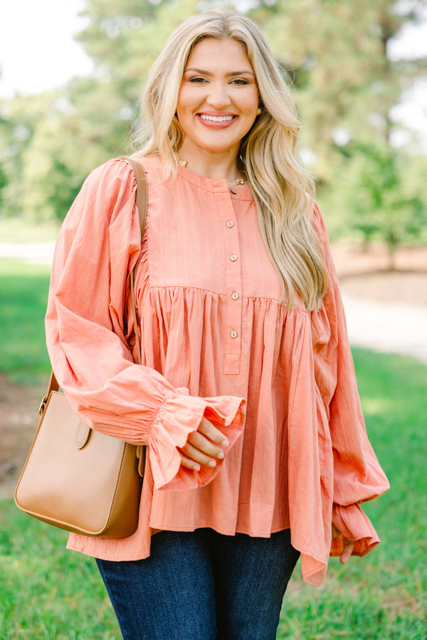 Chic Soul plus size clothing, salmon pink long sleeve button up top with ruffles on the end of the sleeves
