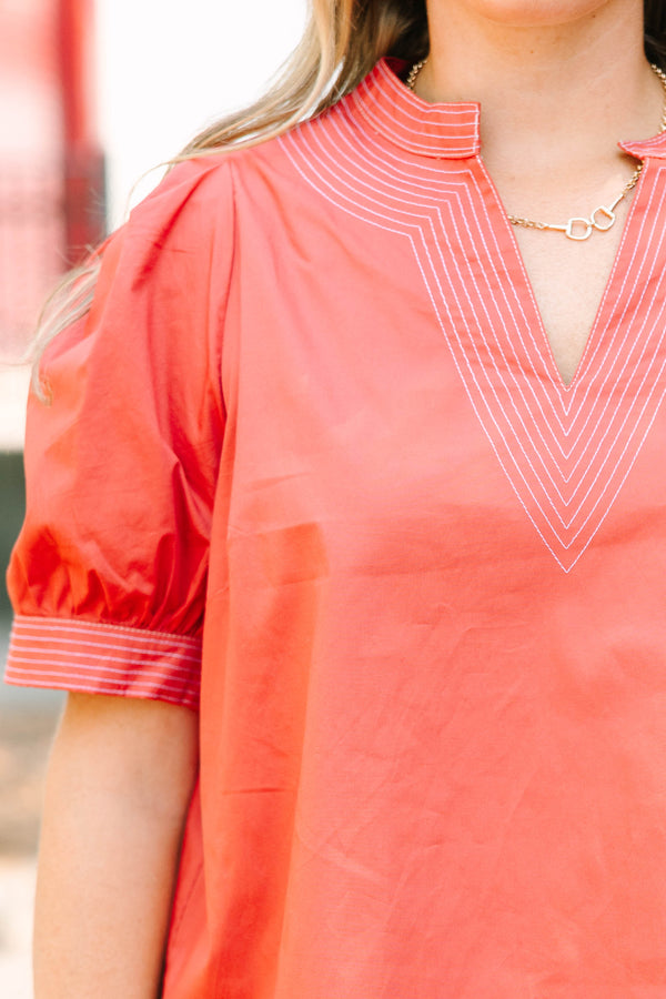 Plus size rust blouse with puff sleeves and contrast white stitching