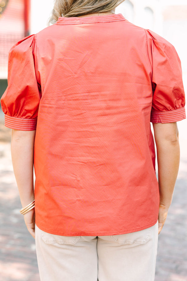 Plus size rust blouse with puff sleeves and contrast white stitching