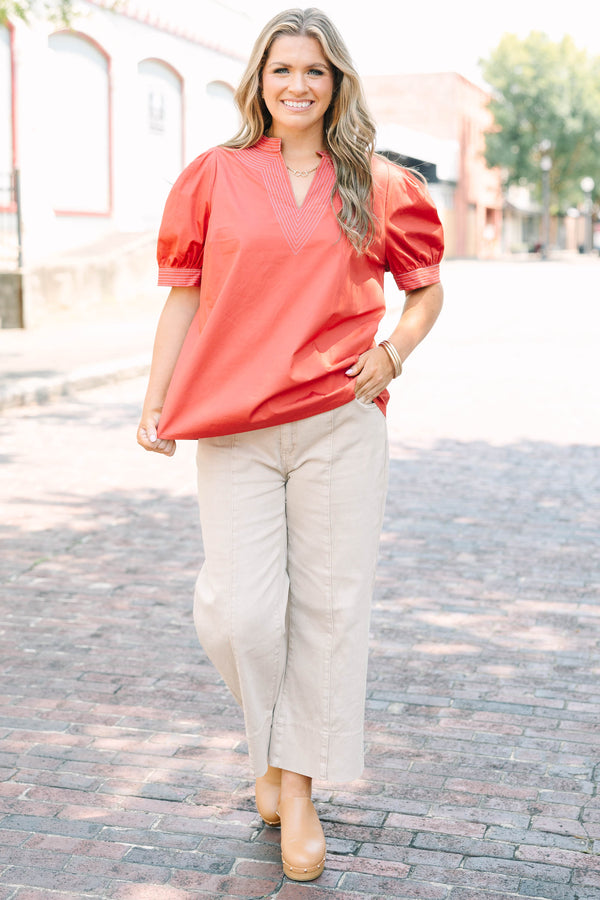 Plus size rust blouse with puff sleeves and contrast white stitching