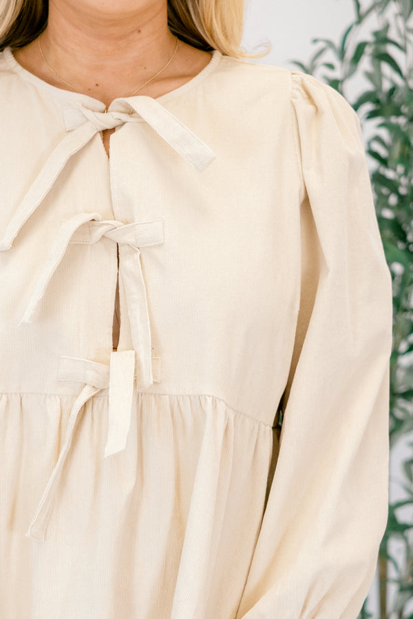 Chic Soul plus size clothing, cream corduroy dress with babydoll silhouette and a trio of ties on the neckline