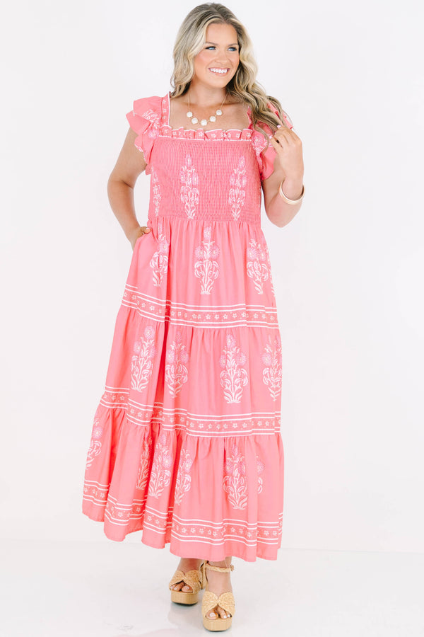 Plus Size bubblegum pink floral maxi dress with smocked bodice, flutter sleeves, and tiered skirt.