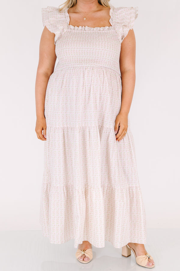 Chic Soul plus size clothing, pink maxi tiered maxi dress with a smocked texture on the bust a square neckline and flutter sleeves as well as a small floral pattern throughout 