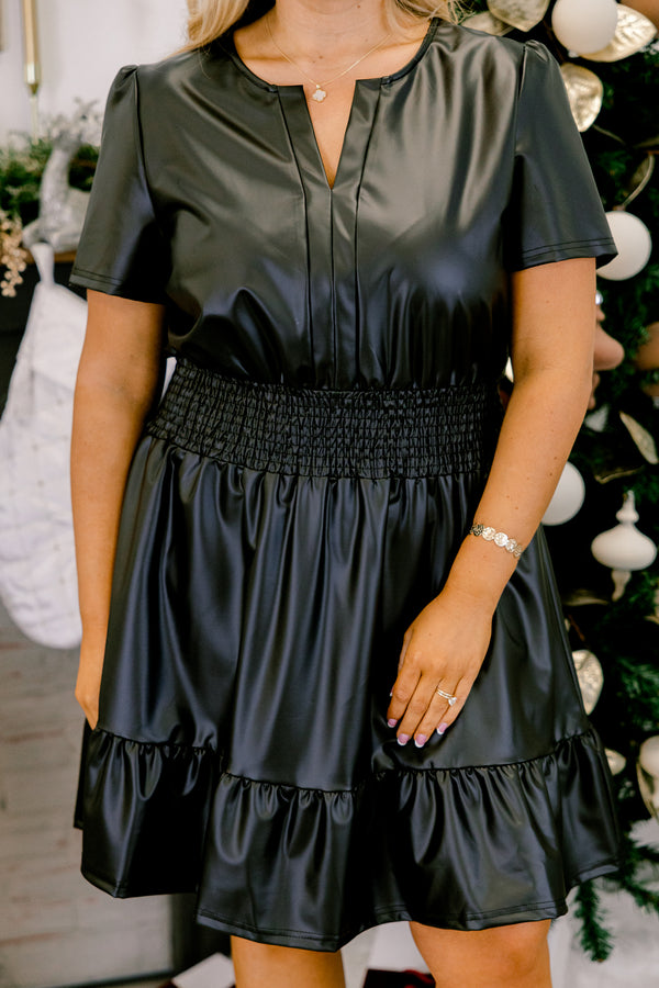 Chic Soul plus size clothing, black short sleeve faux leather mini dress with cinched smocked waist with v cutout along neckline with ruffle along bottom