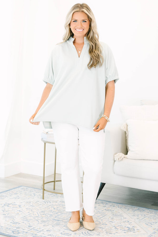 Plus Size sage green short sleeve top with a split neckline and elasticized puff sleeves.