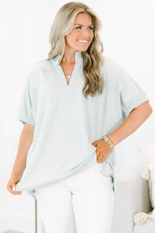 Plus Size sage green short sleeve top with a split neckline and elasticized puff sleeves.