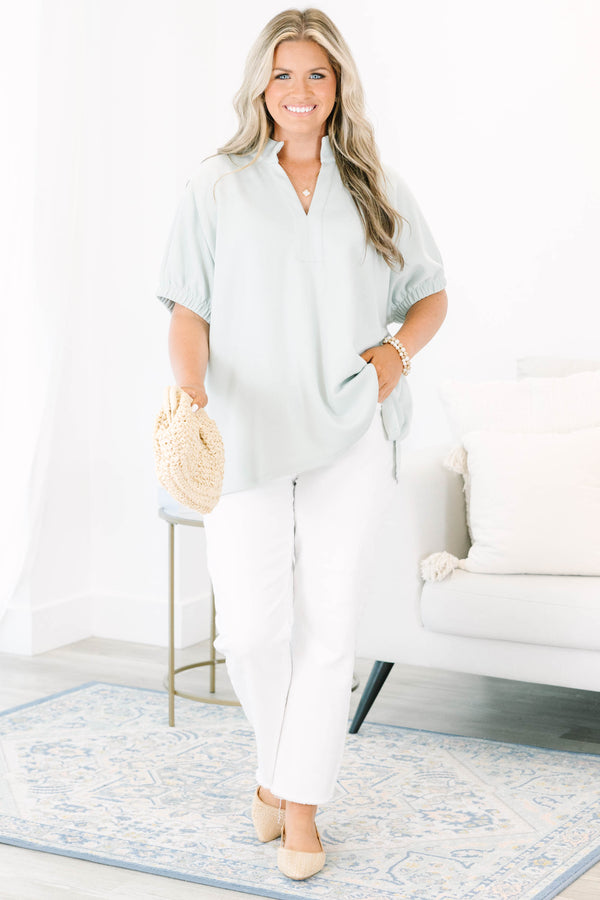 Plus Size sage green short sleeve top with a split neckline and elasticized puff sleeves.