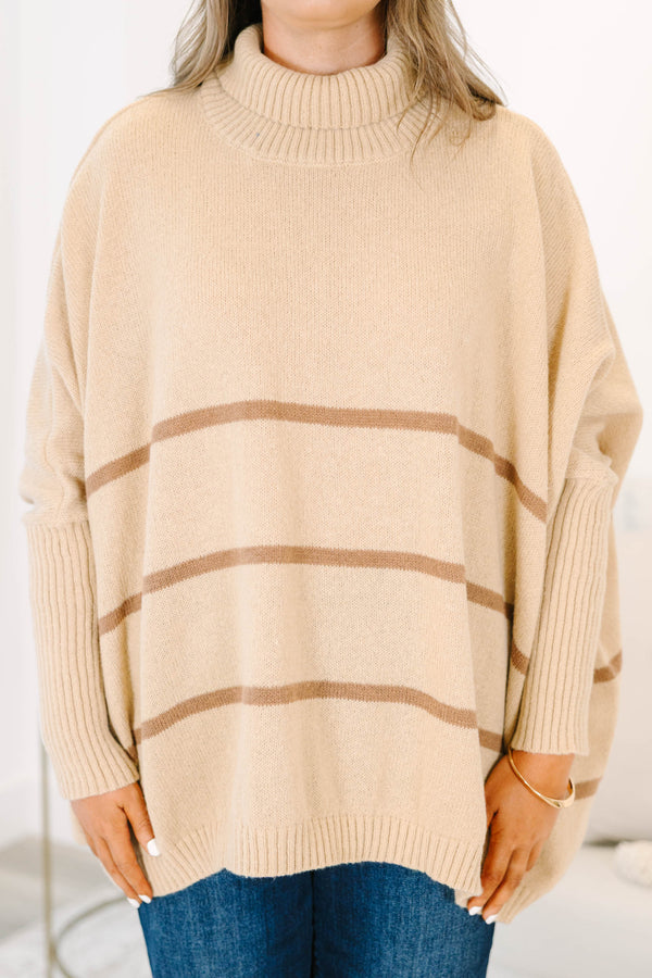 Plus Size taupe oversized turtleneck sweater with horizontal brown stripes and ribbed trim.
