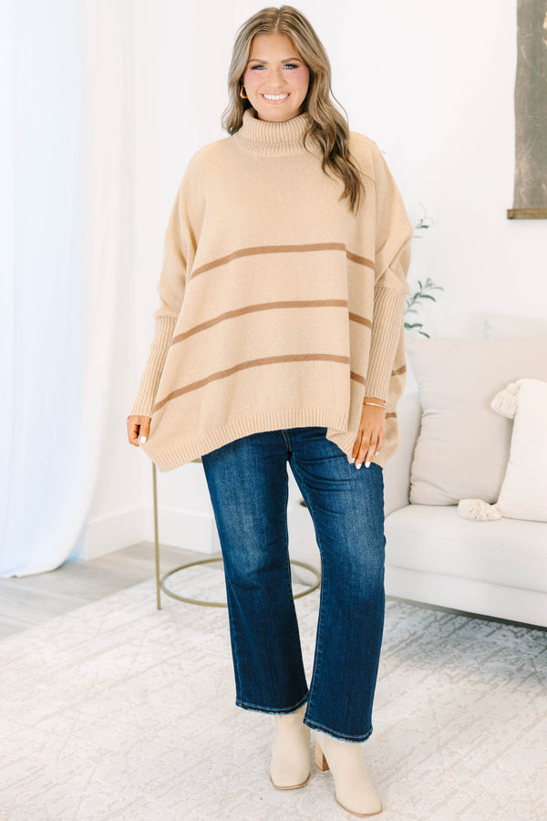Plus Size taupe oversized turtleneck sweater with horizontal brown stripes and ribbed trim.