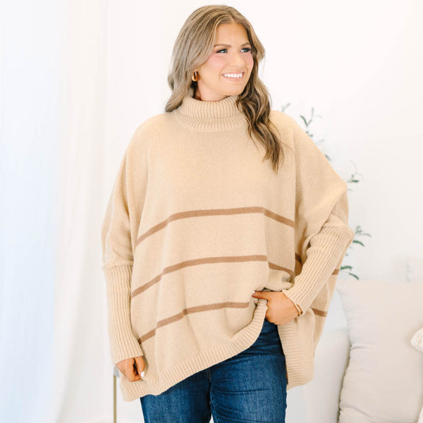 Plus Size taupe oversized turtleneck sweater with horizontal brown stripes and ribbed trim.