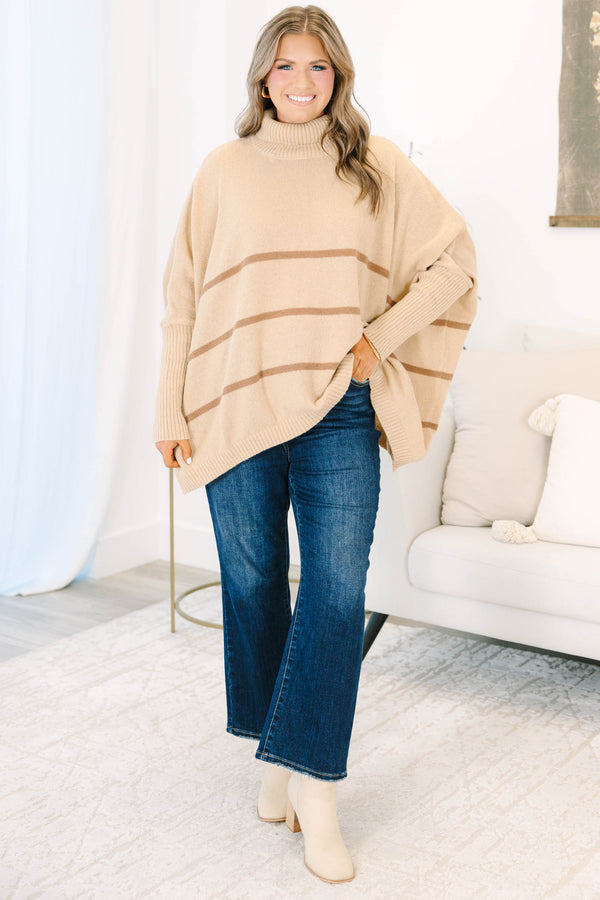 Plus Size taupe oversized turtleneck sweater with horizontal brown stripes and ribbed trim.