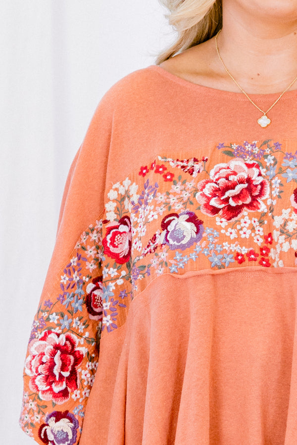 Chic Soul plus size clothing, terracotta short sleeve top with an embroidered floral pattern going across the chest and onto the sleeves