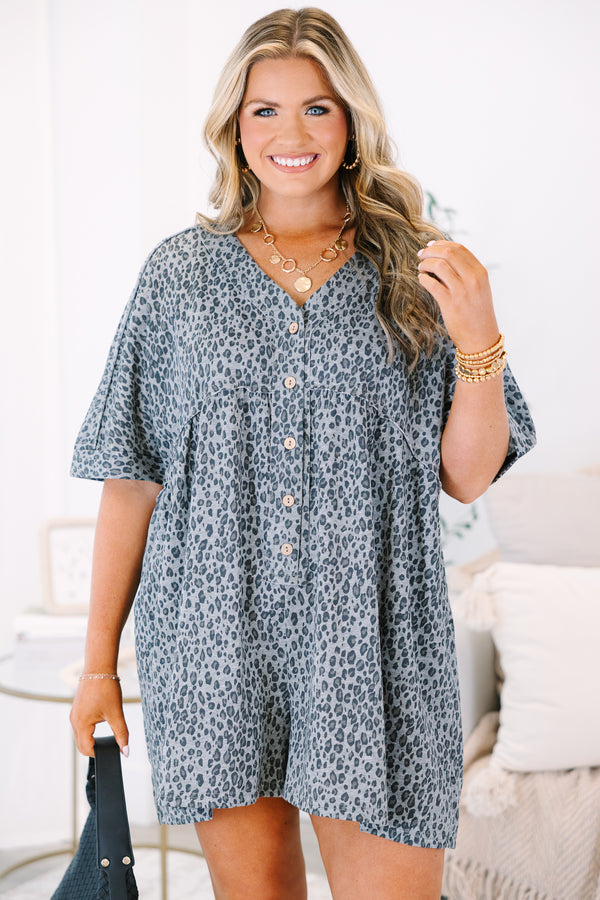 Plus Size black leopard print romper with a V-neckline, button-down front, and short sleeves.
