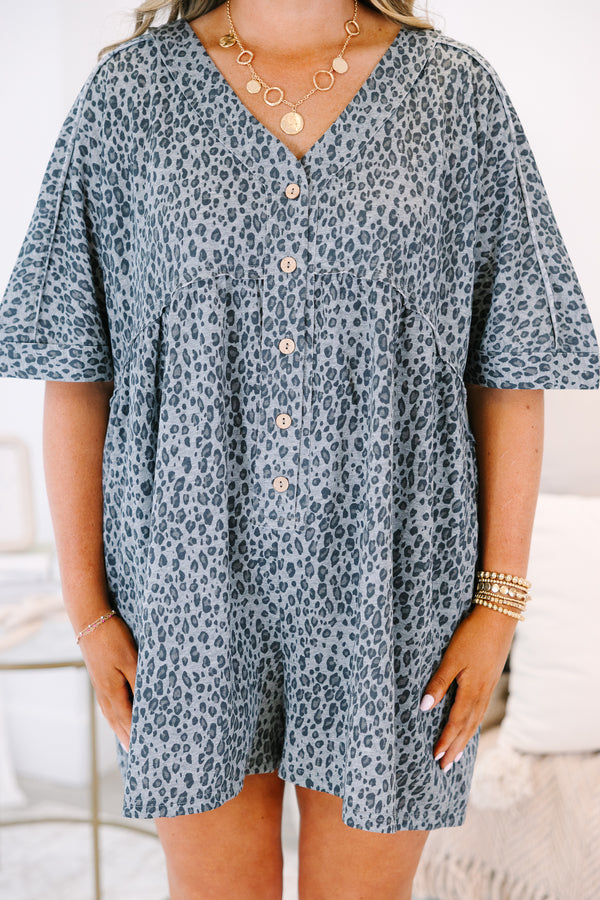 Plus Size black leopard print romper with a V-neckline, button-down front, and short sleeves.