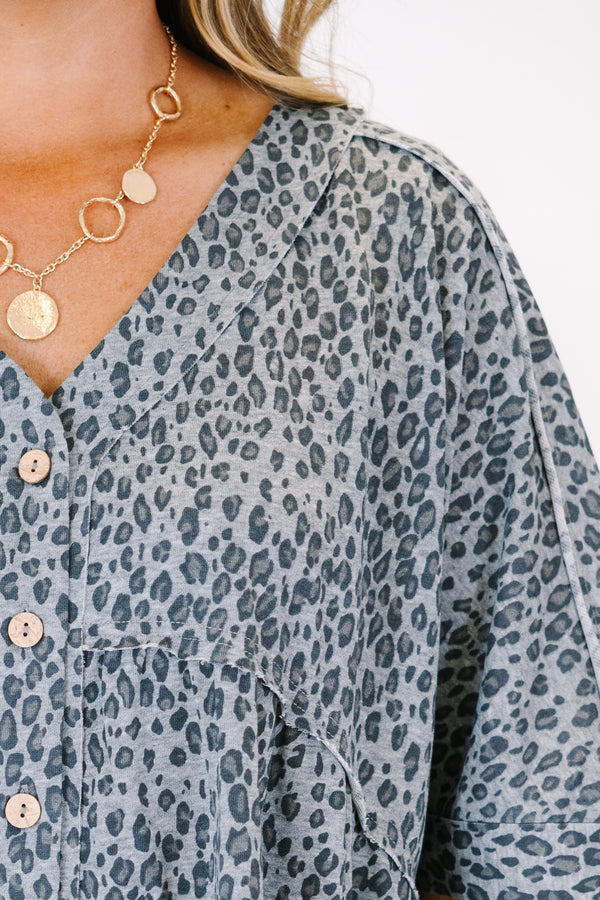 Plus Size black leopard print romper with a V-neckline, button-down front, and short sleeves.