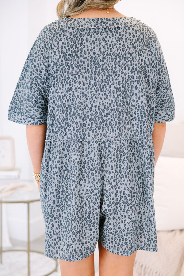 Plus Size black leopard print romper with a V-neckline, button-down front, and short sleeves.