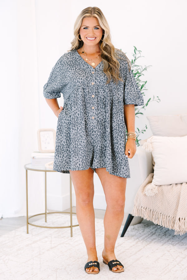 Plus Size black leopard print romper with a V-neckline, button-down front, and short sleeves.
