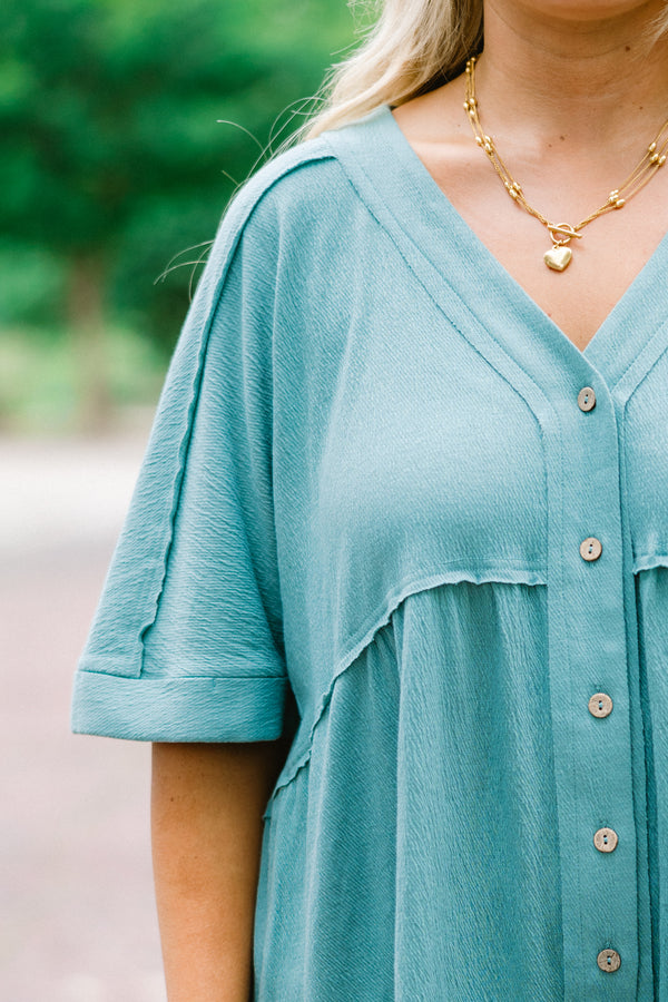 Chic Soul plus size clothing, dusty teal romper with short sleeves that have cuffs at the end of the sleeves and buttons going down to the waist area 