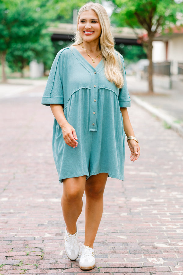 Chic Soul plus size clothing, dusty teal romper with short sleeves that have cuffs at the end of the sleeves and buttons going down to the waist area 