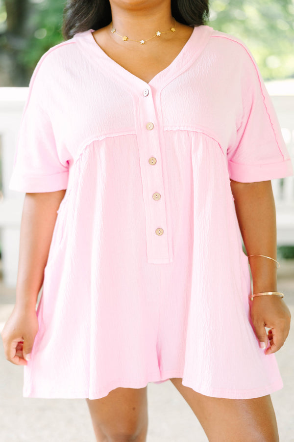 Plus Size orchid pink short sleeve romper with a V-neckline and button-down front detail.