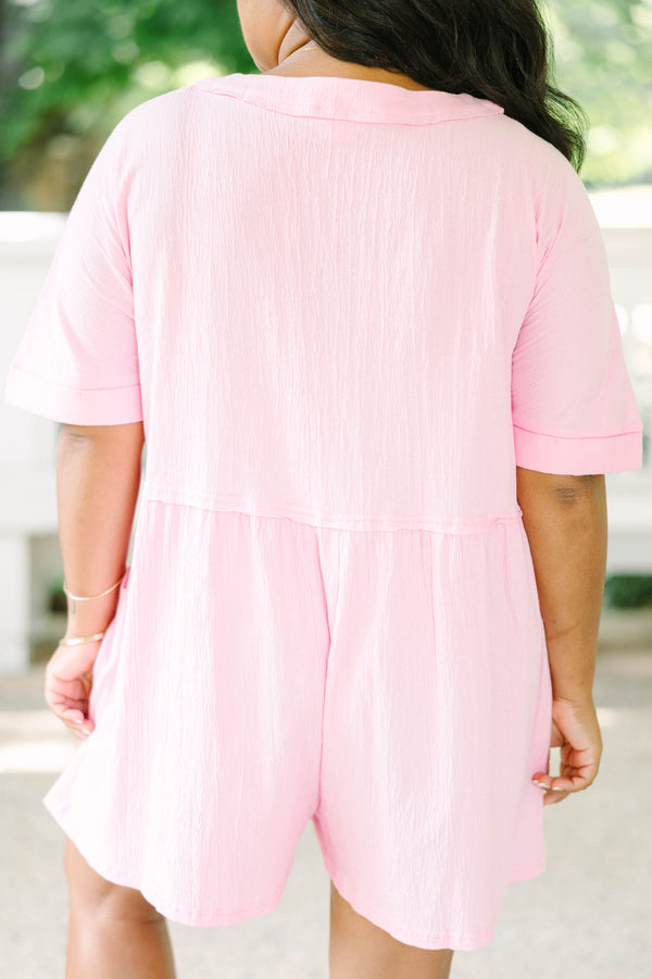 Plus Size orchid pink short sleeve romper with a V-neckline and button-down front detail.