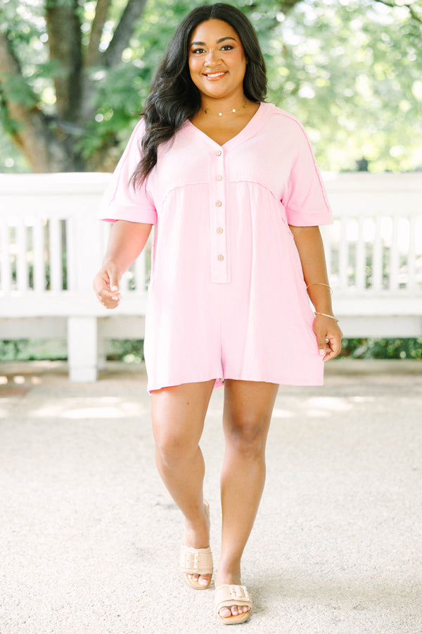 Plus Size orchid pink short sleeve romper with a V-neckline and button-down front detail.