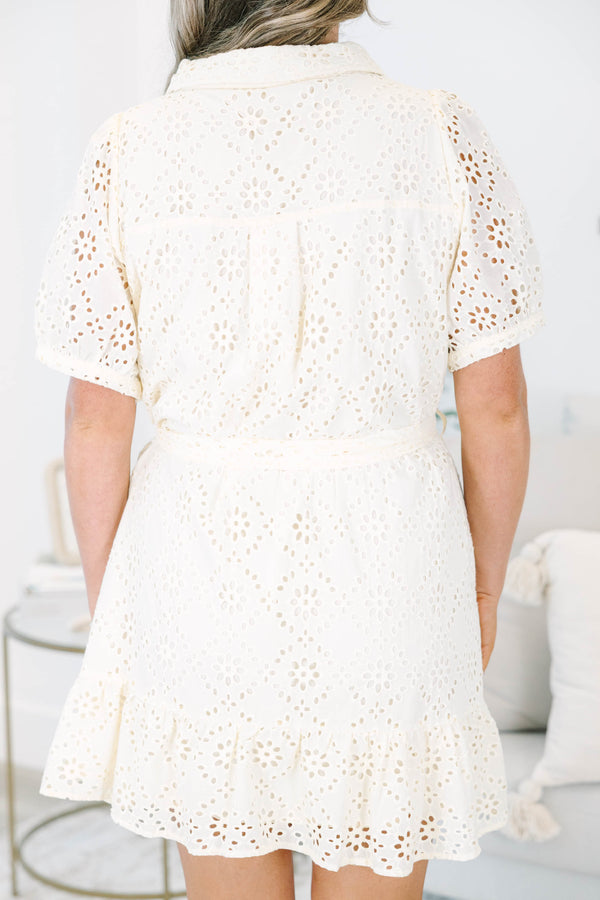 Plus size cream eyelet shirt dress with short puff sleeves and a tie waist for a flowy fit.