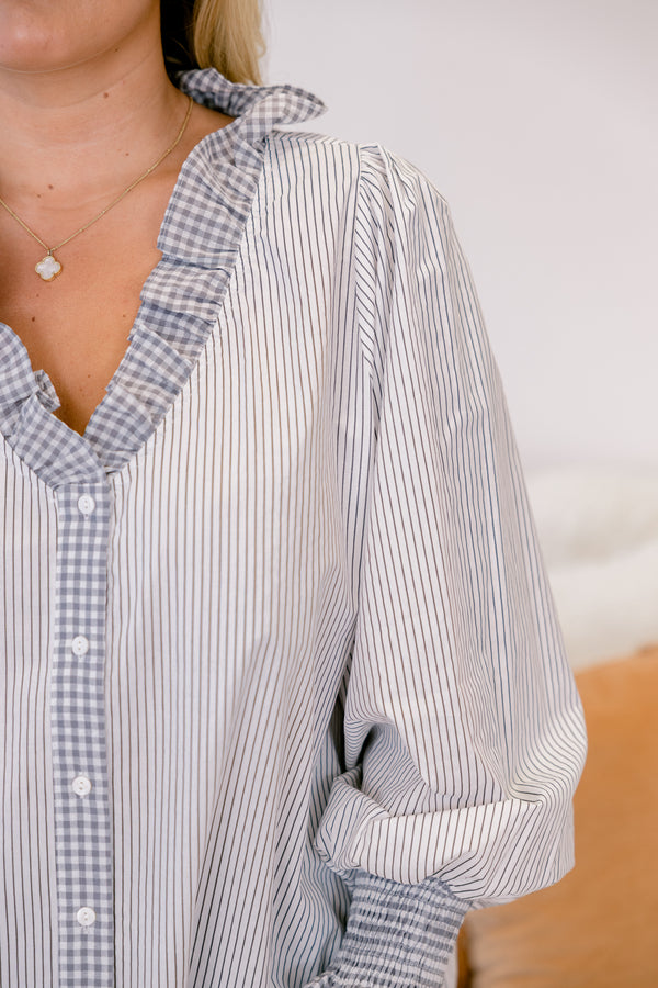 Chic Soul plus size clothing, grey stripped button-up top with a ruffle detail at the end of the sleeves and around the collar 