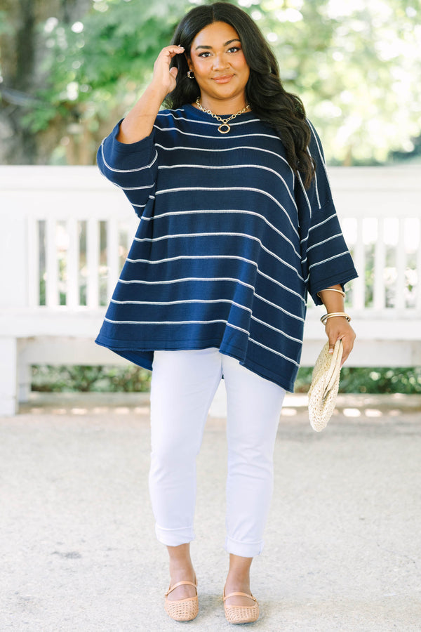 Plus Size navy and white horizontal striped knit sweater tunic with a relaxed fit and wide sleeves.
