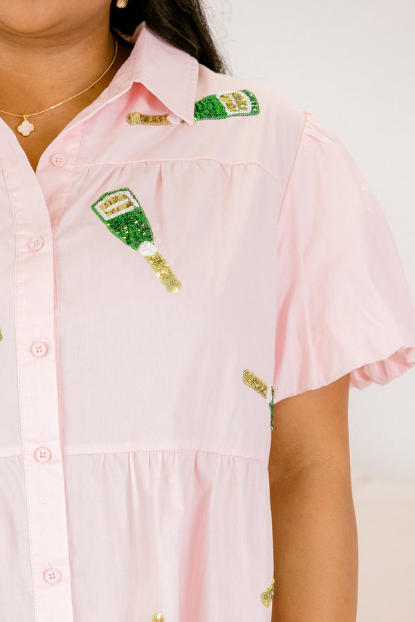 Chic Soul plus size clothing, puffed-short-sleeve solid pink collared ruffled buttoned babydoll dress with embroidered sequin patches of champagne bottles scattered across dress 