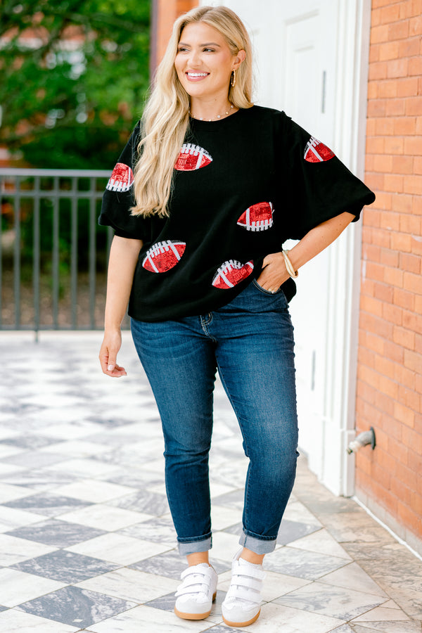 Chic Soul plus size clothing, black top with bubble sleeves that has red sparkly football patches throughout the shirt 
