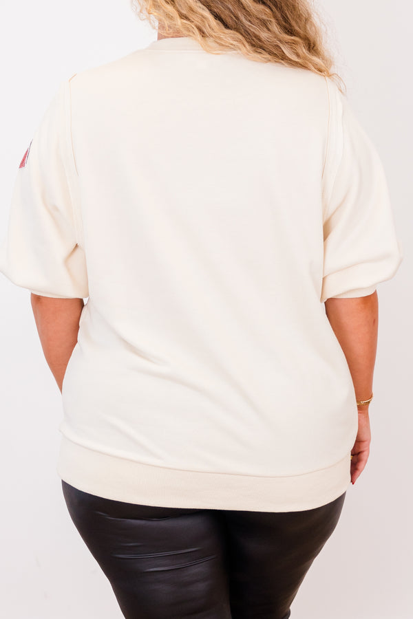 Chic Soul plus size clothing, short-sleeve ivory high-scoop-neckline top with puffed sleeves and sequined red and black footballs scattered across top