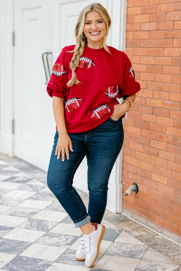 Chic Soul plus size clothing, red top with bubble sleeves that has red sparkly football patches throughout the shirt 