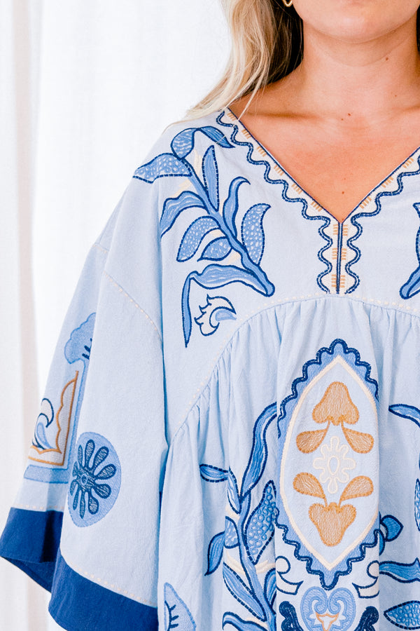 Chic Soul Plus size clothing, blue short sleeve top with with a floral abstract patter and a slight v-neckline 