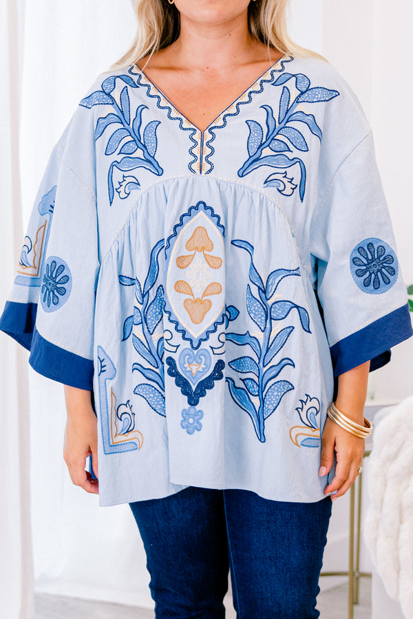 Chic Soul Plus size clothing, blue short sleeve top with with a floral abstract patter and a slight v-neckline 