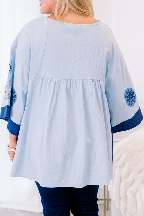 Chic Soul Plus size clothing, blue short sleeve top with with a floral abstract patter and a slight v-neckline 