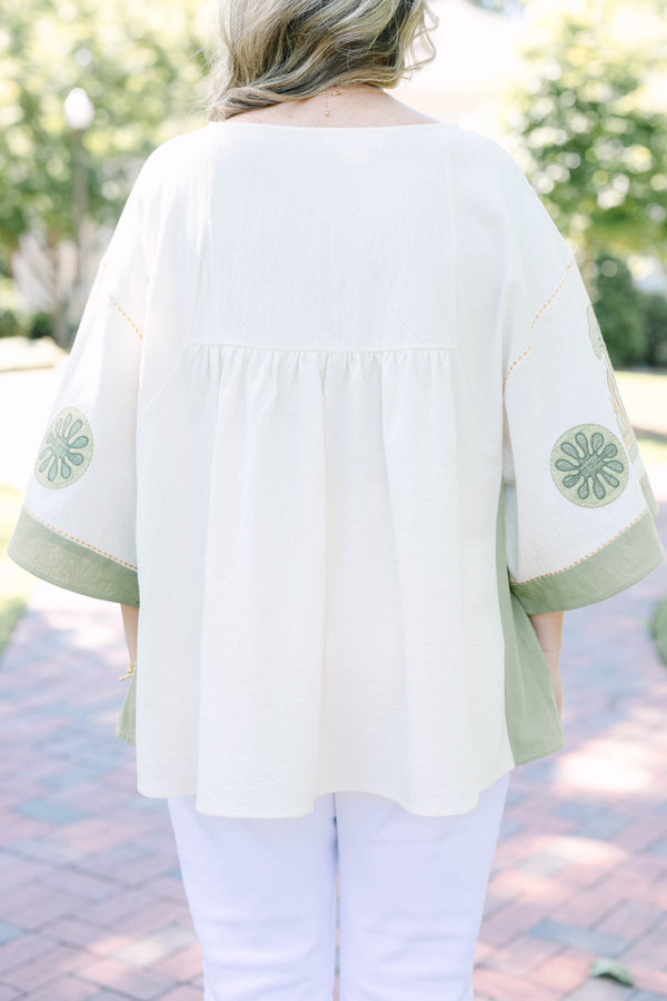 Plus size top in olive, a flowy 100% cotton boho blouse with intricate embroidery.
