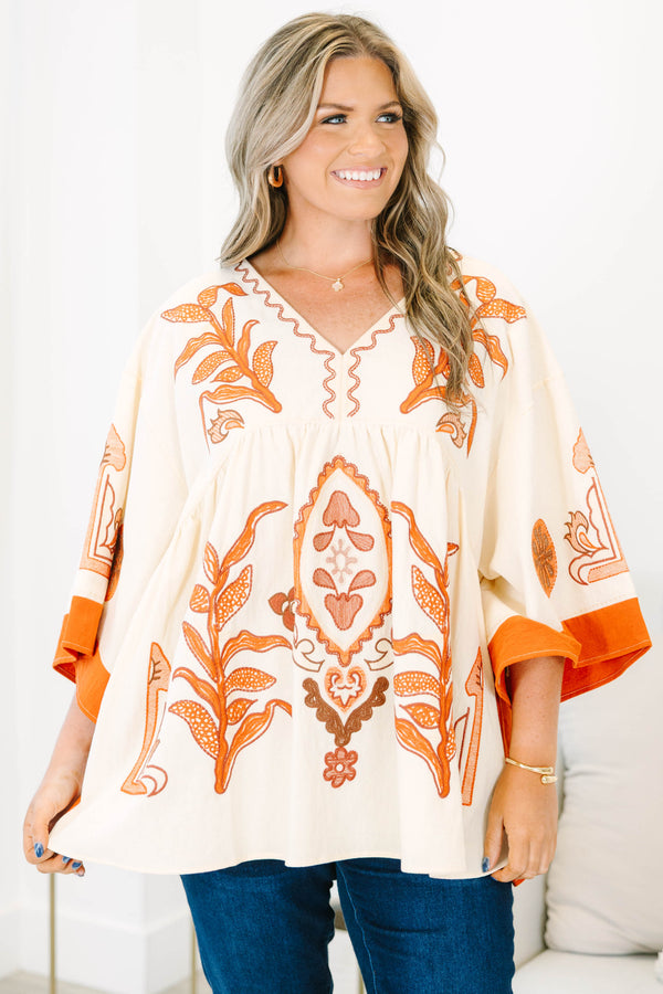 Plus size clothing, cream colored tunic top with orange embroidery