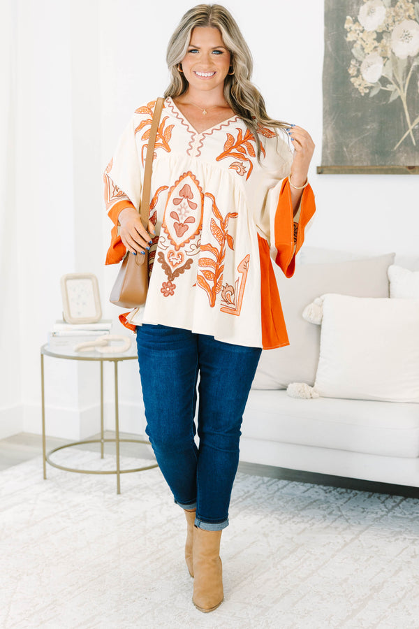 Plus size clothing, cream colored tunic top with orange embroidery