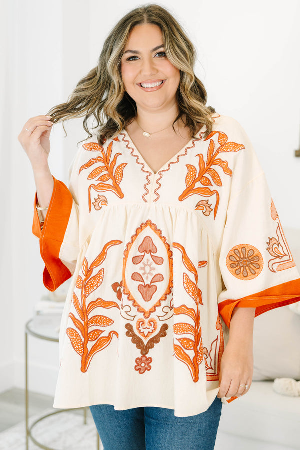 Plus size clothing, cream colored tunic top with orange embroidery
